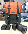 Sony A7 4 Camera backpack with camera equipment on a counter in a store setting