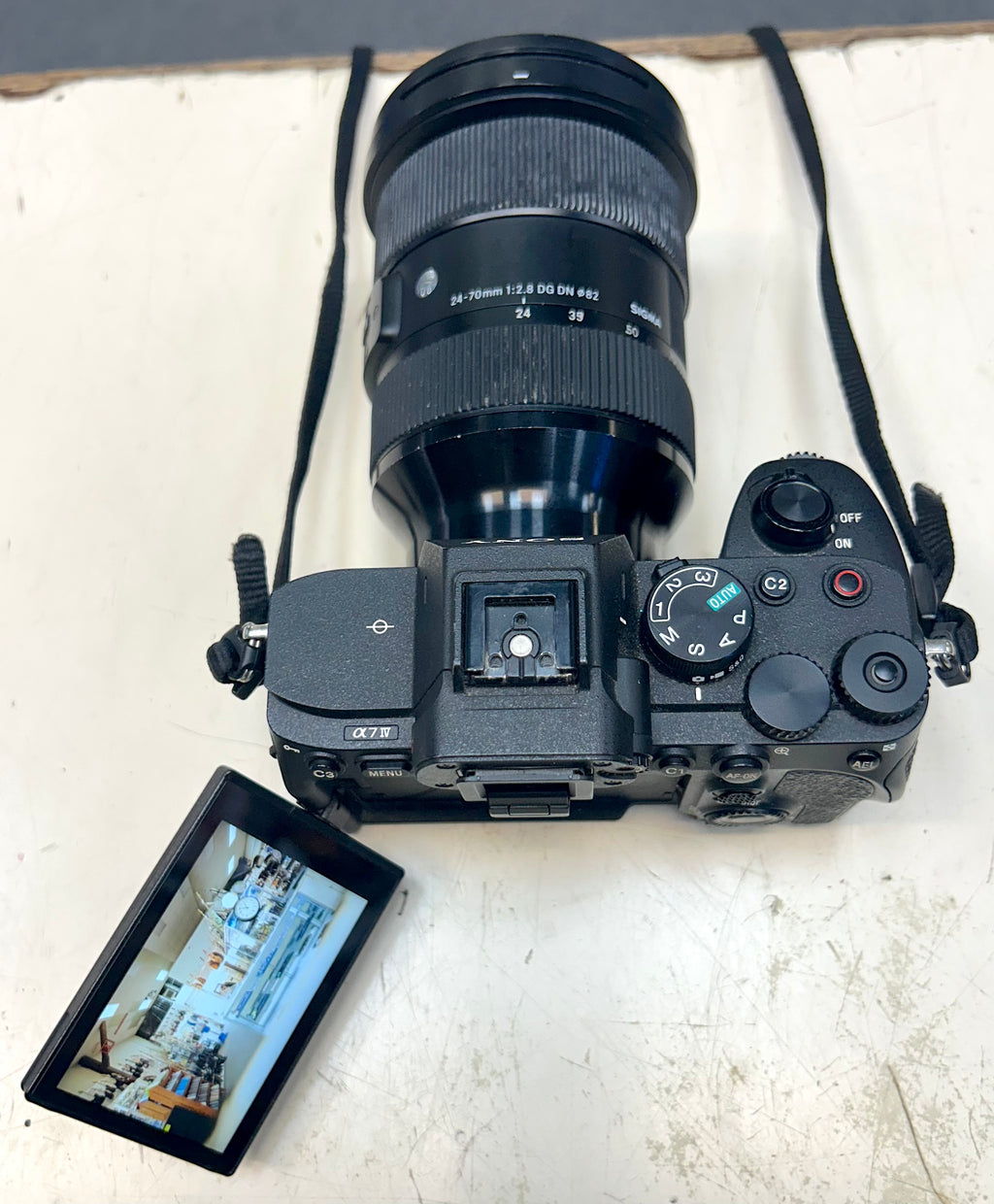 Sony A7 Camera with attached lens on a white surface