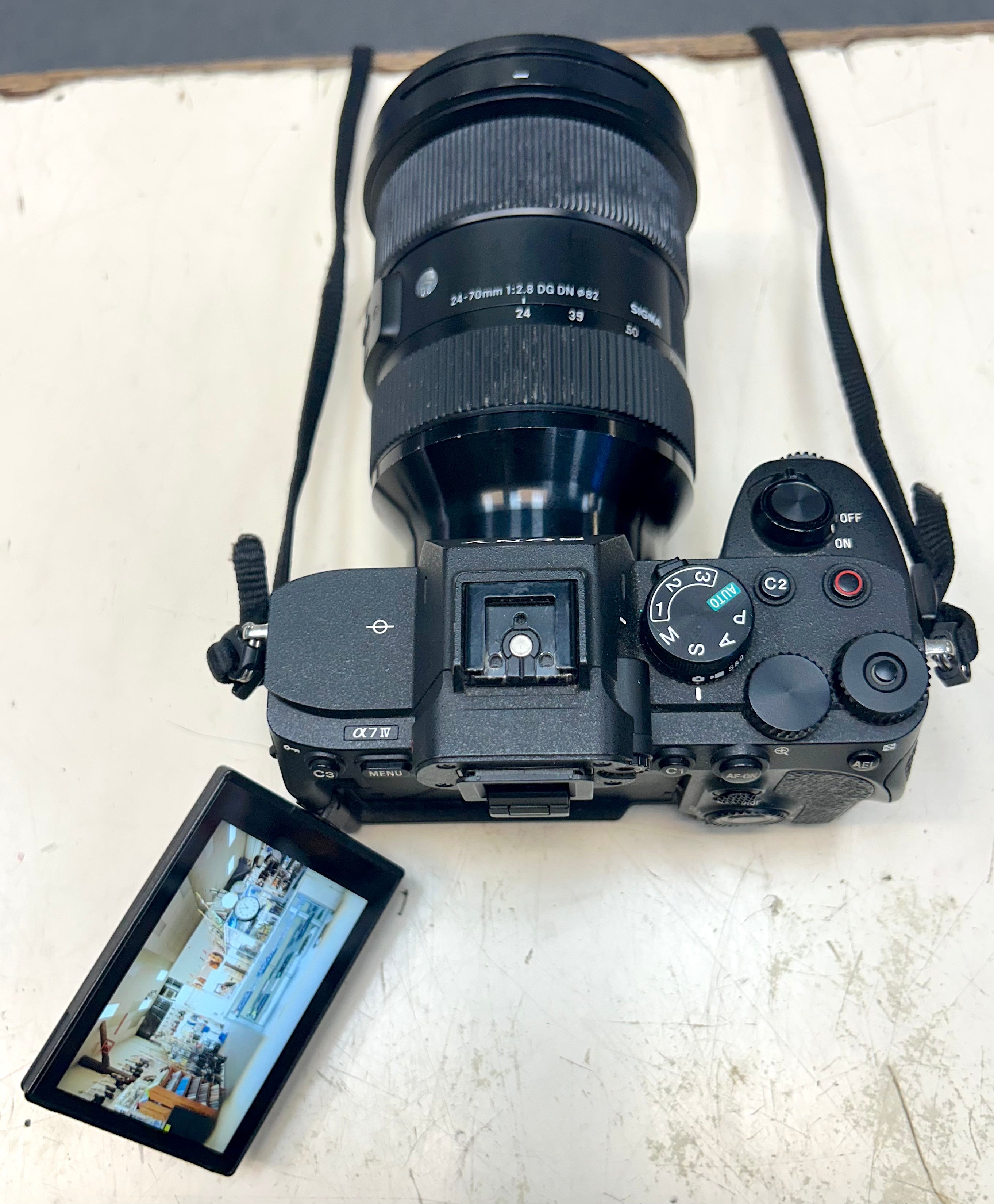 Sony A7 Camera with attached lens on a white surface