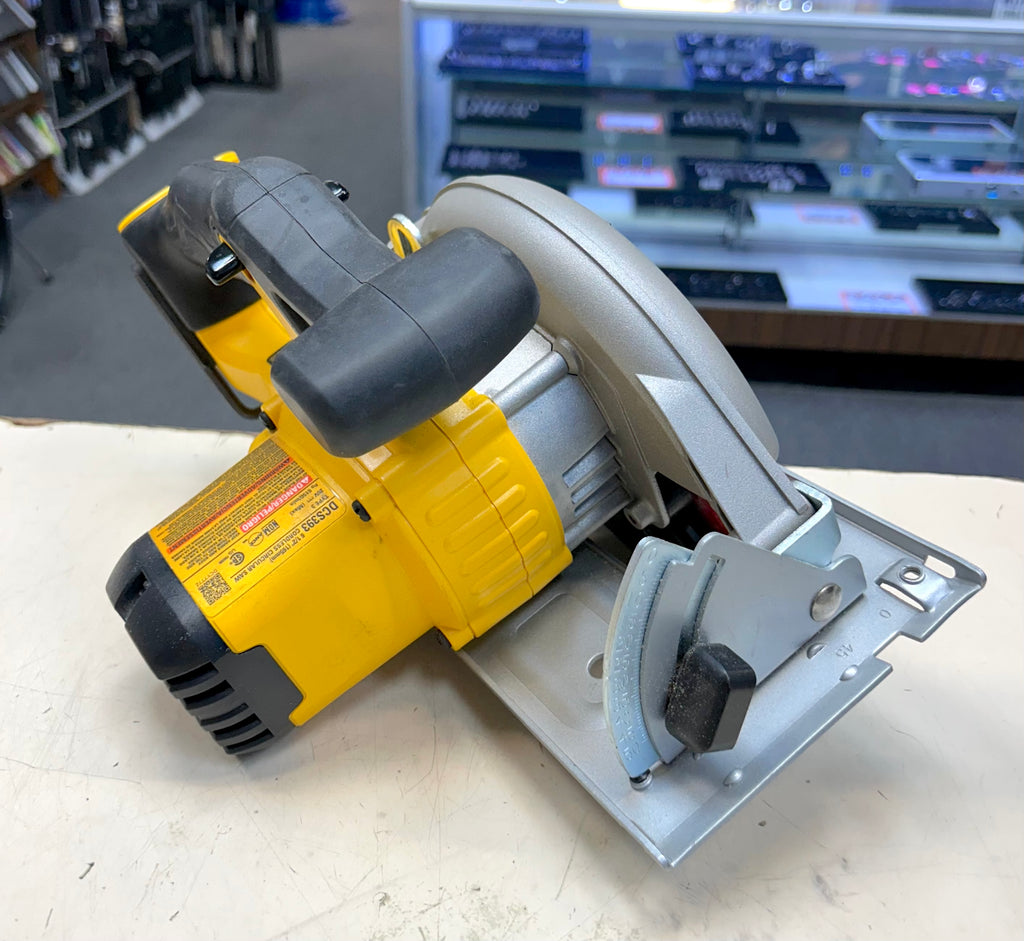 Circular saw on a workbench with a blurred workshop background