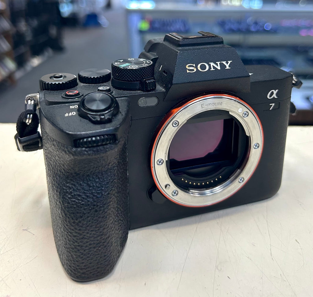 Sony A7 IV camera on a light surface with a blurred background