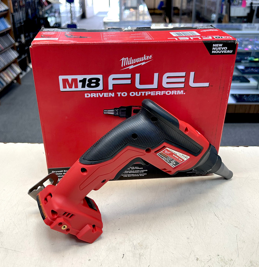 Red Milwaukee M18 FUEL power tool on a white surface with a red packaging box in the background.