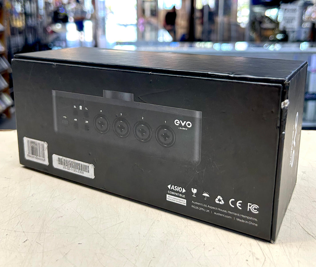 Black electronic device packaging with 'evo' branding on a light surface.