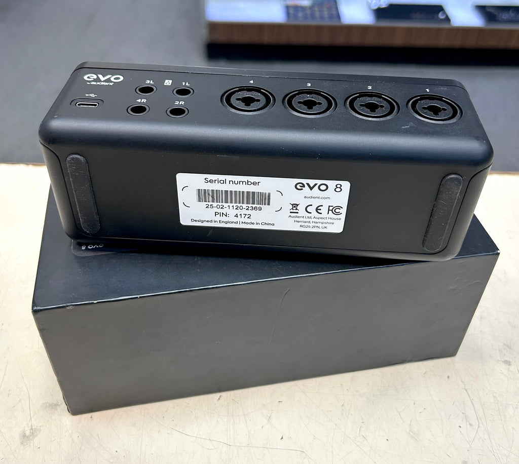 Black electronic device with 'EVO' branding on a cardboard box