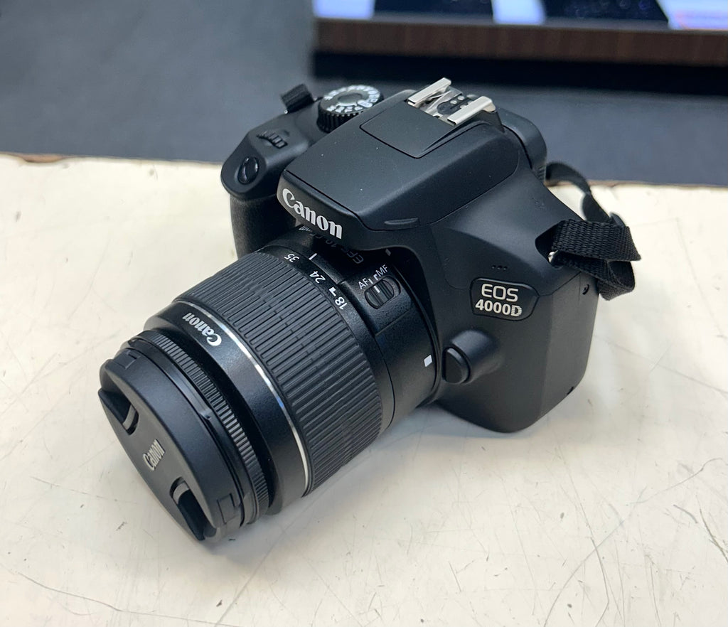 Canon EOS 4000D camera on a light surface