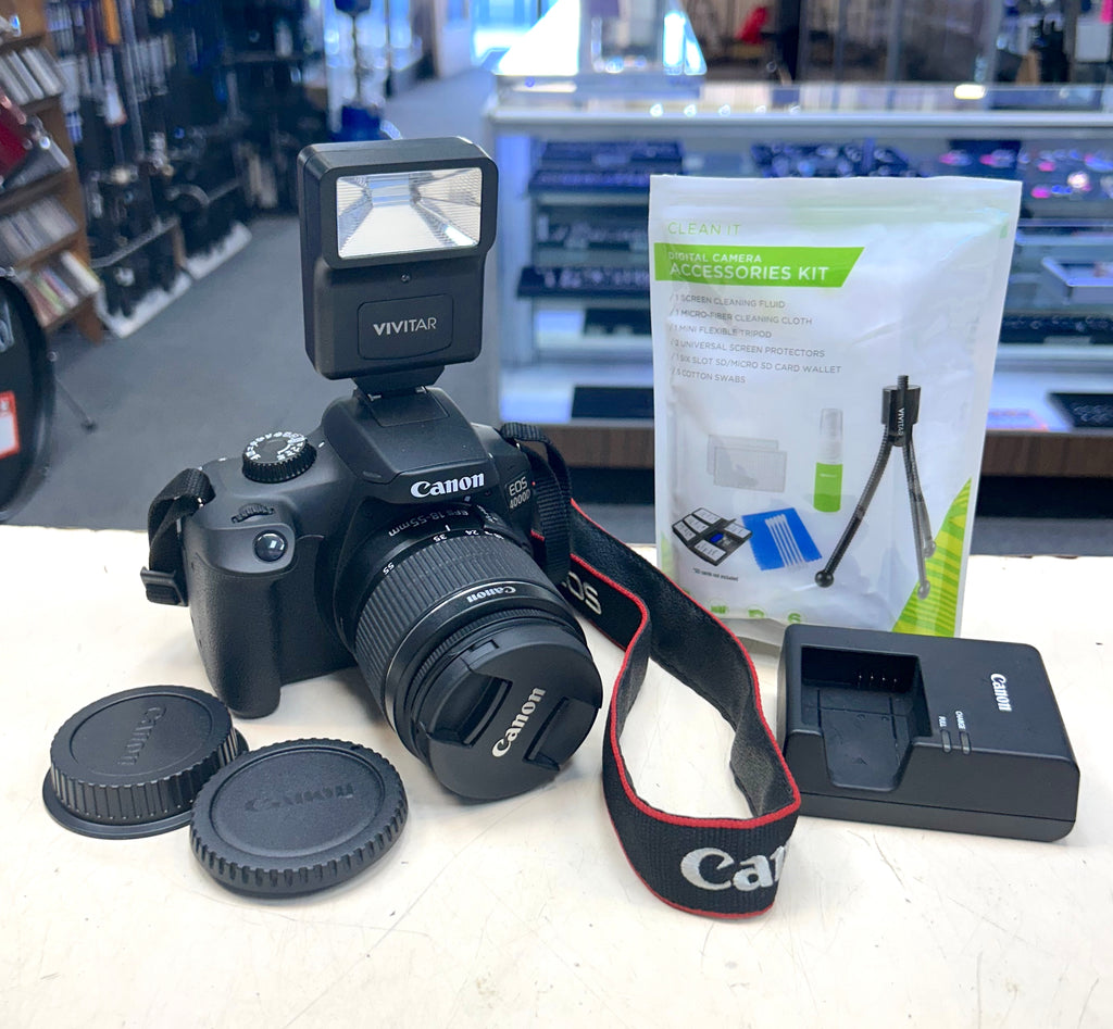 Canon camera with accessories on a table in a store setting