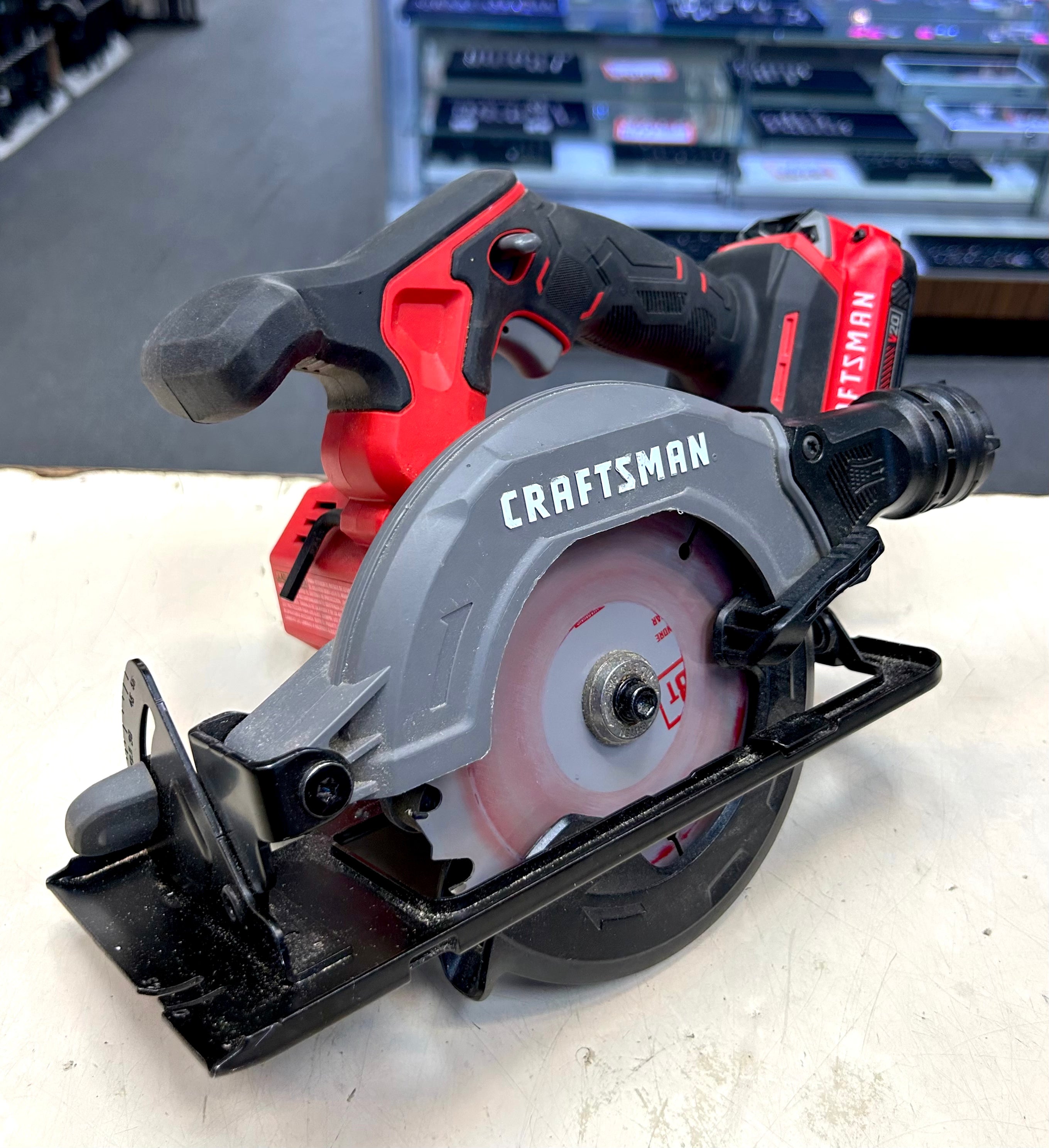 Craftsman circular saw on a white surface with a blurred background
