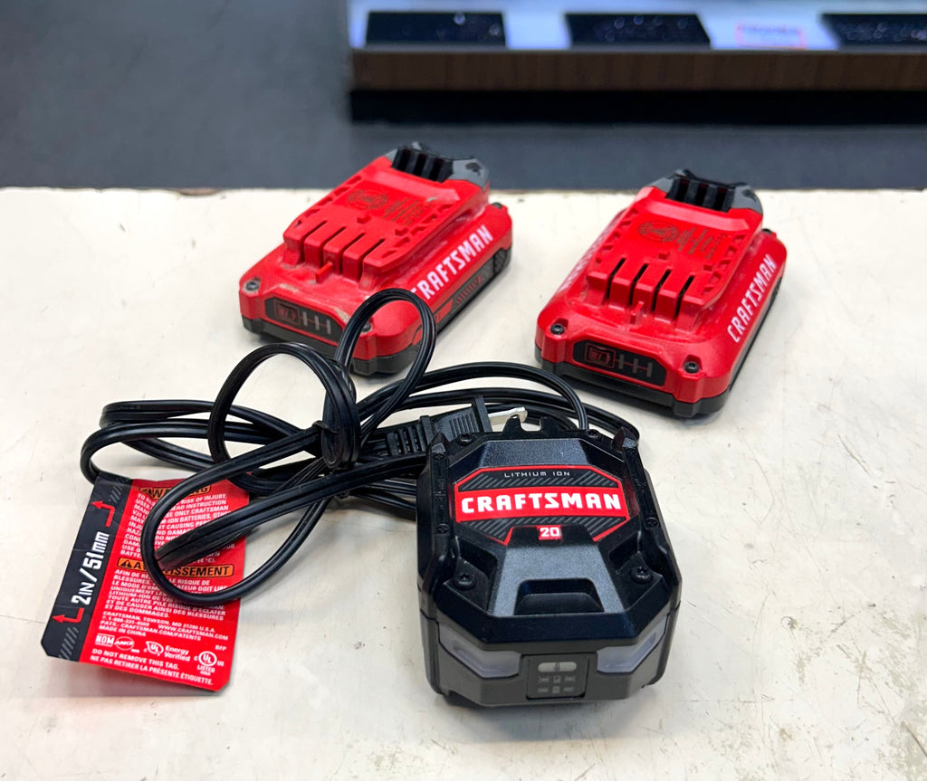 Two red and black Craftsman battery chargers on a white surface.
