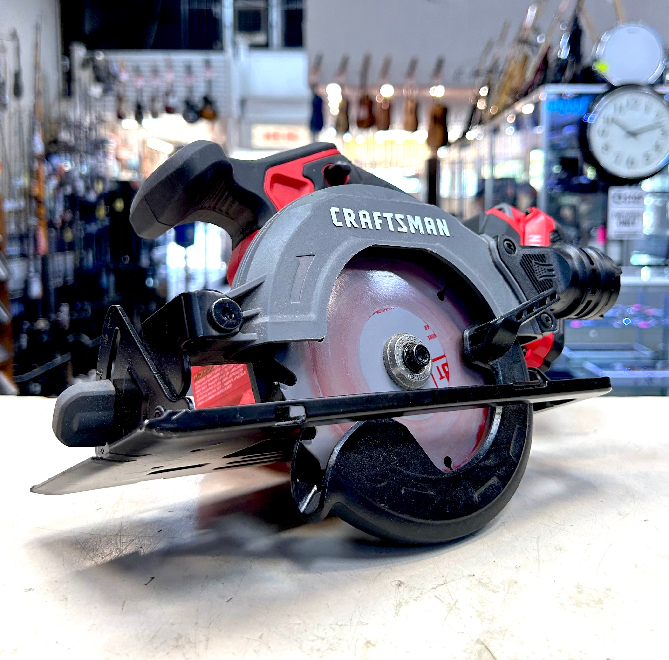 Craftsman circular saw on a workbench in a workshop setting
