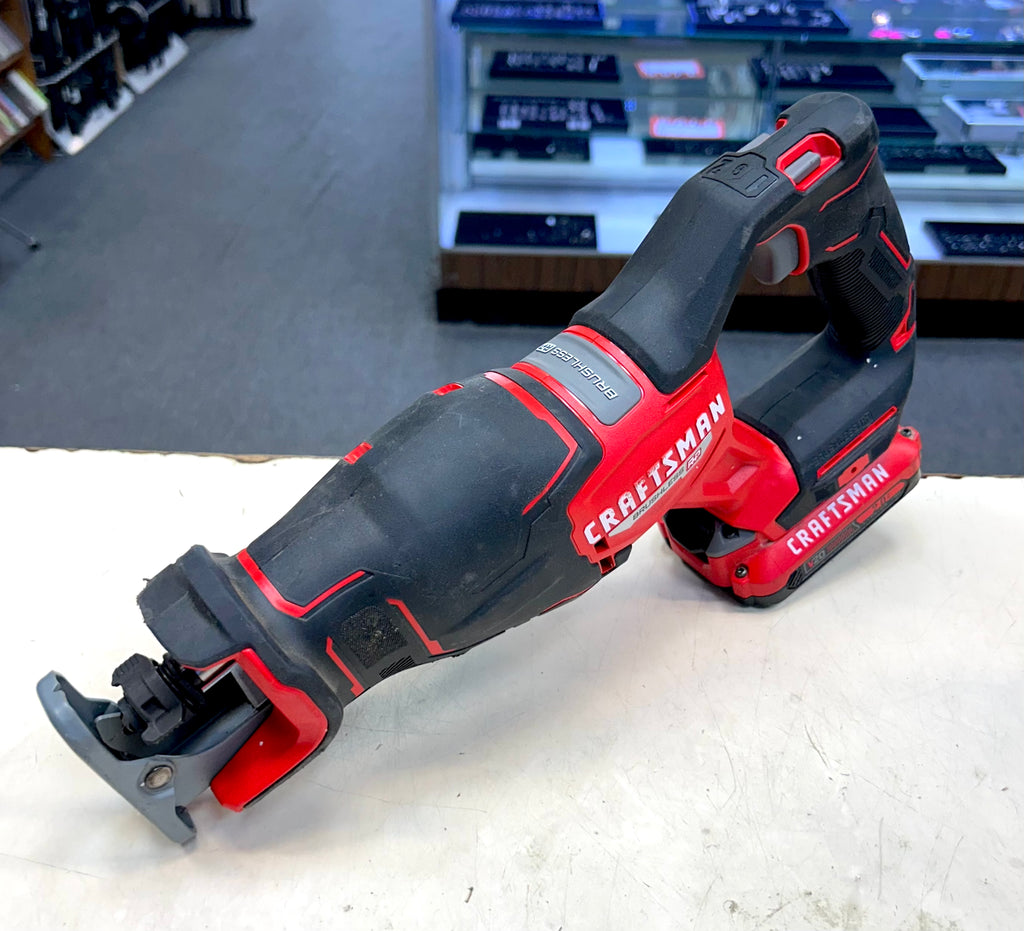Craftsman oscillating tool on a white surface with a store shelf in the background