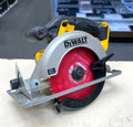 DeWalt circular saw on a white surface with a blurred background