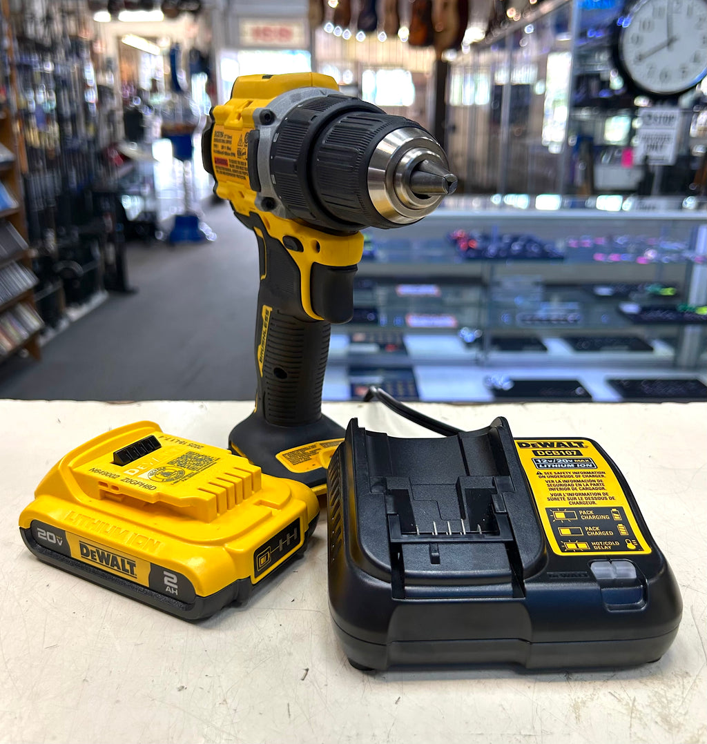 DeWalt drill and battery pack on a counter with a store background