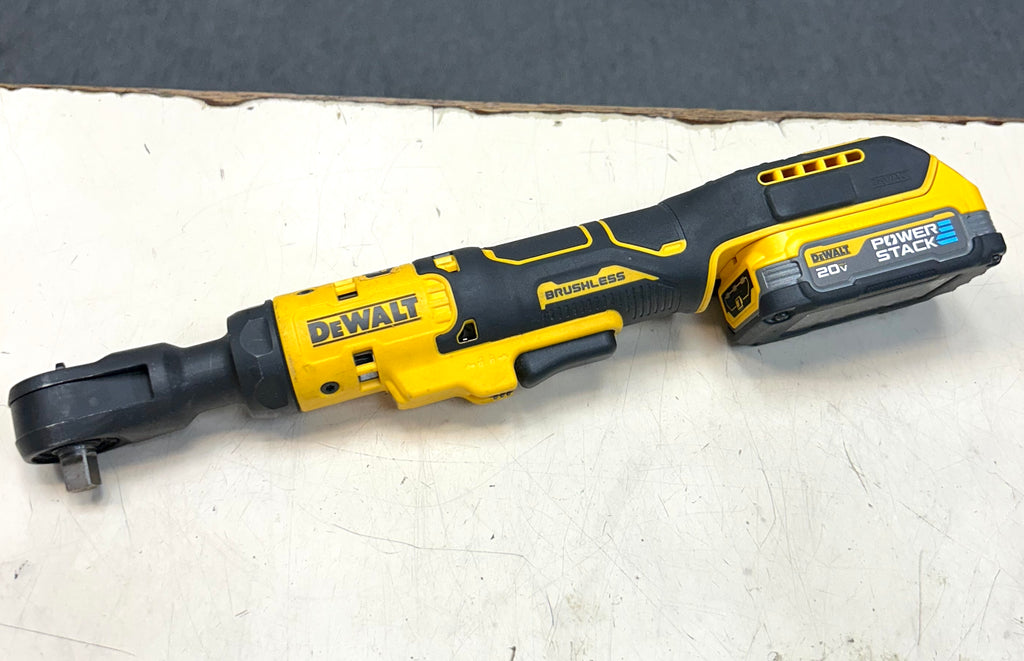 Yellow and black DEWALT power tool on a white surface