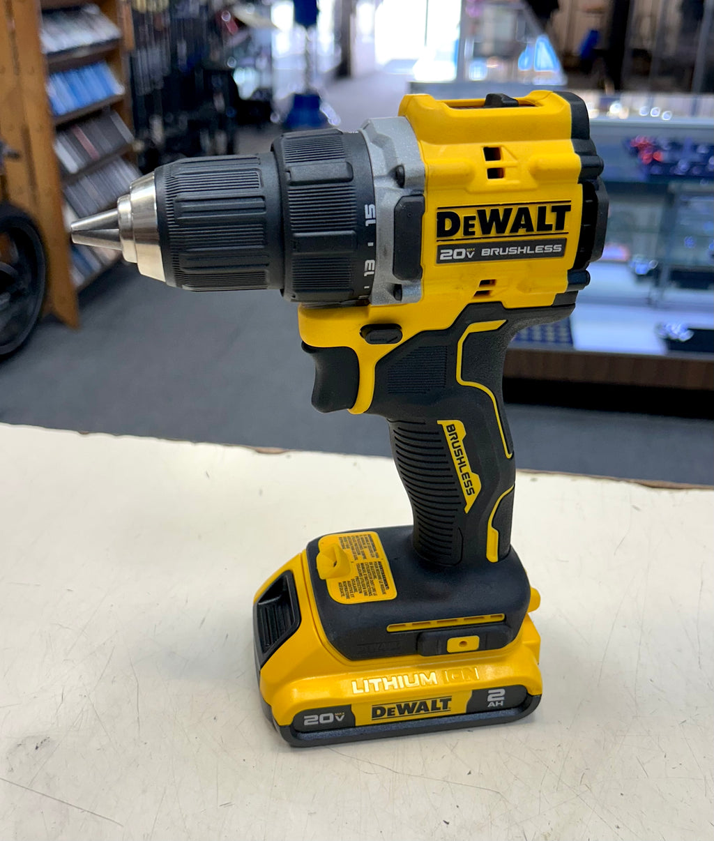 DeWalt cordless drill on a white surface with a blurred background