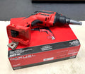 Red Milwaukee drill on top of its packaging box with a gray background
