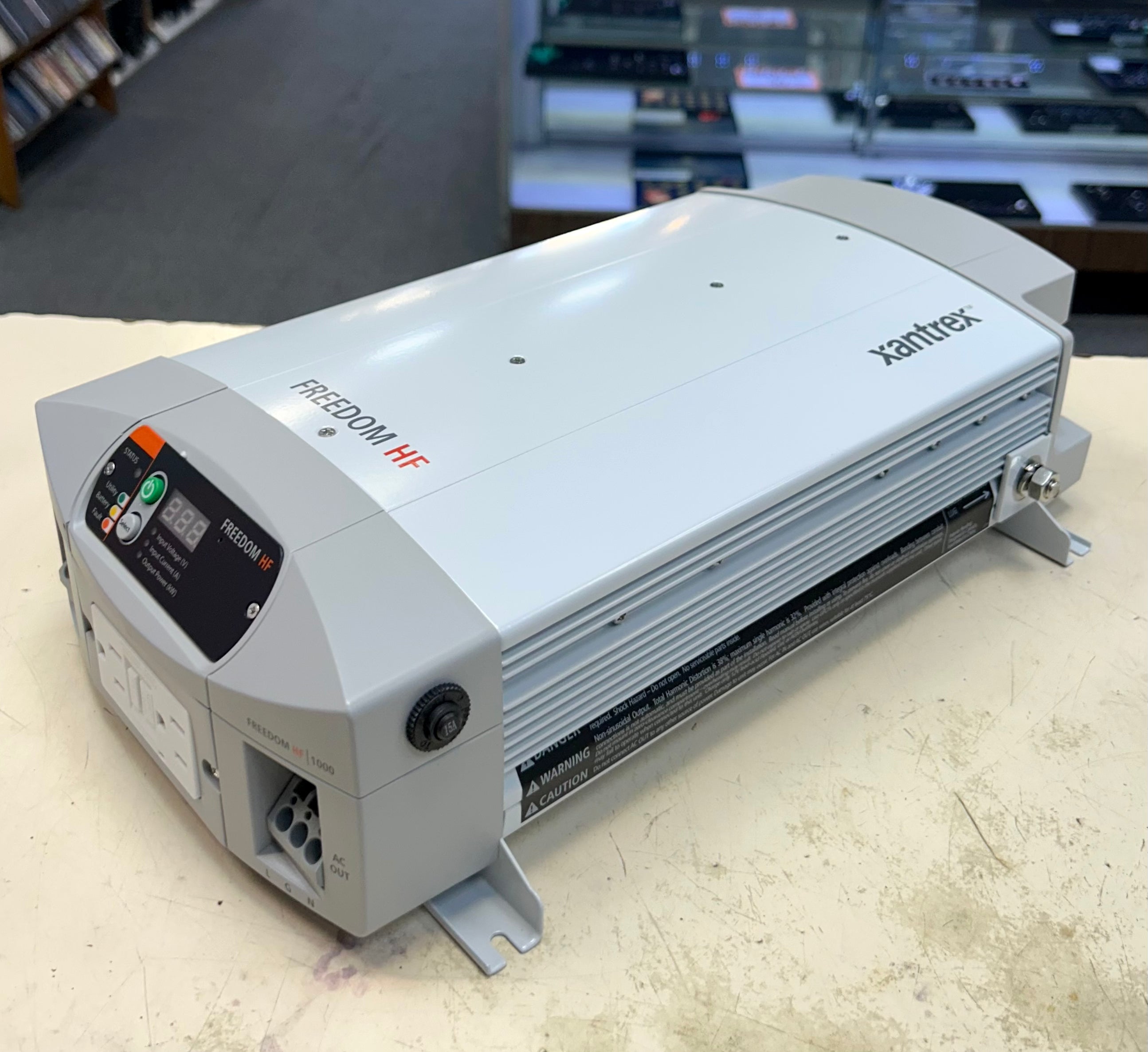 Xantrex power inverter on a table with a blurred background