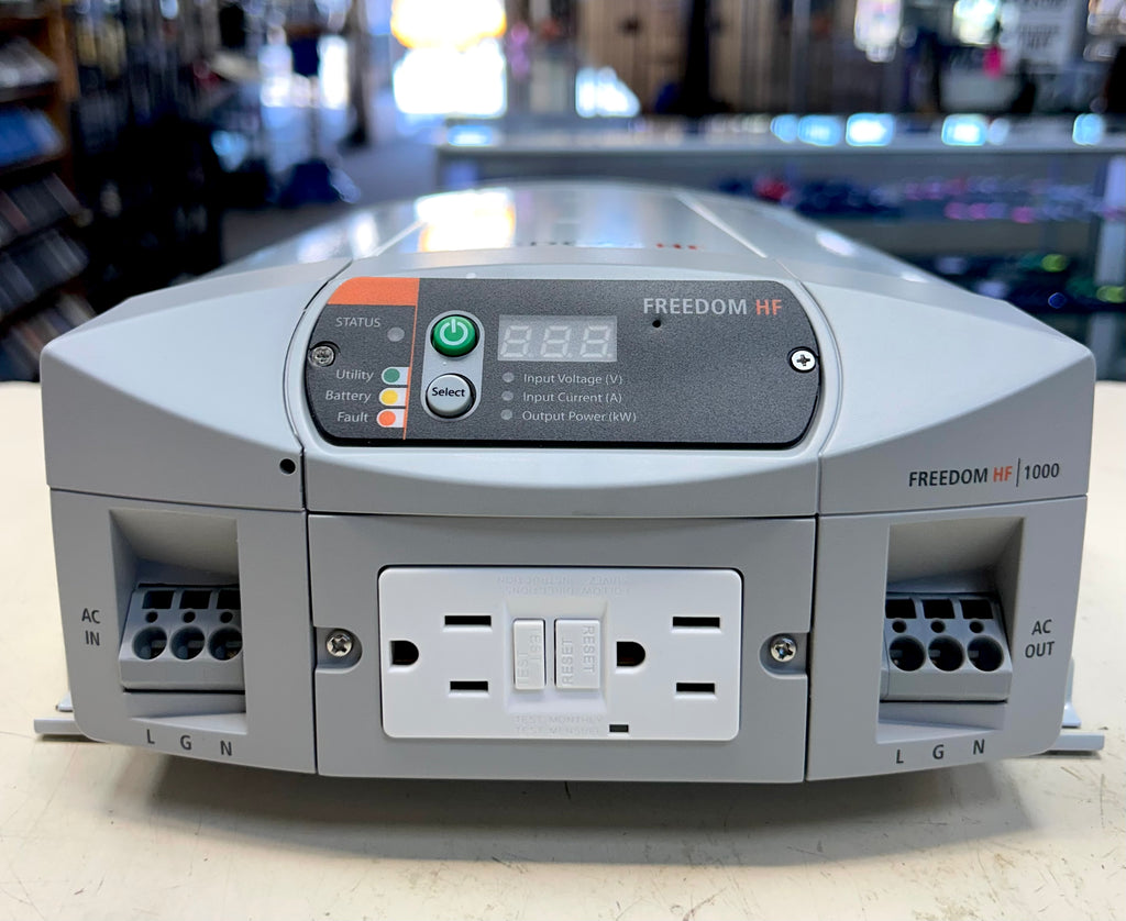 Power inverter labeled 'Freedom HF' on a blurred background