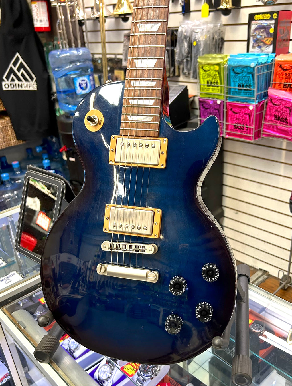 Gibson Les Paul Blue electric guitar on display in a music store
