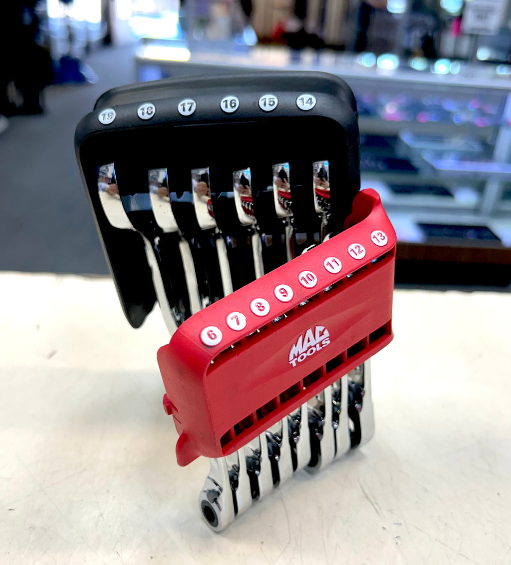 Set of MAC Tools ratchets on a white surface with a blurred background