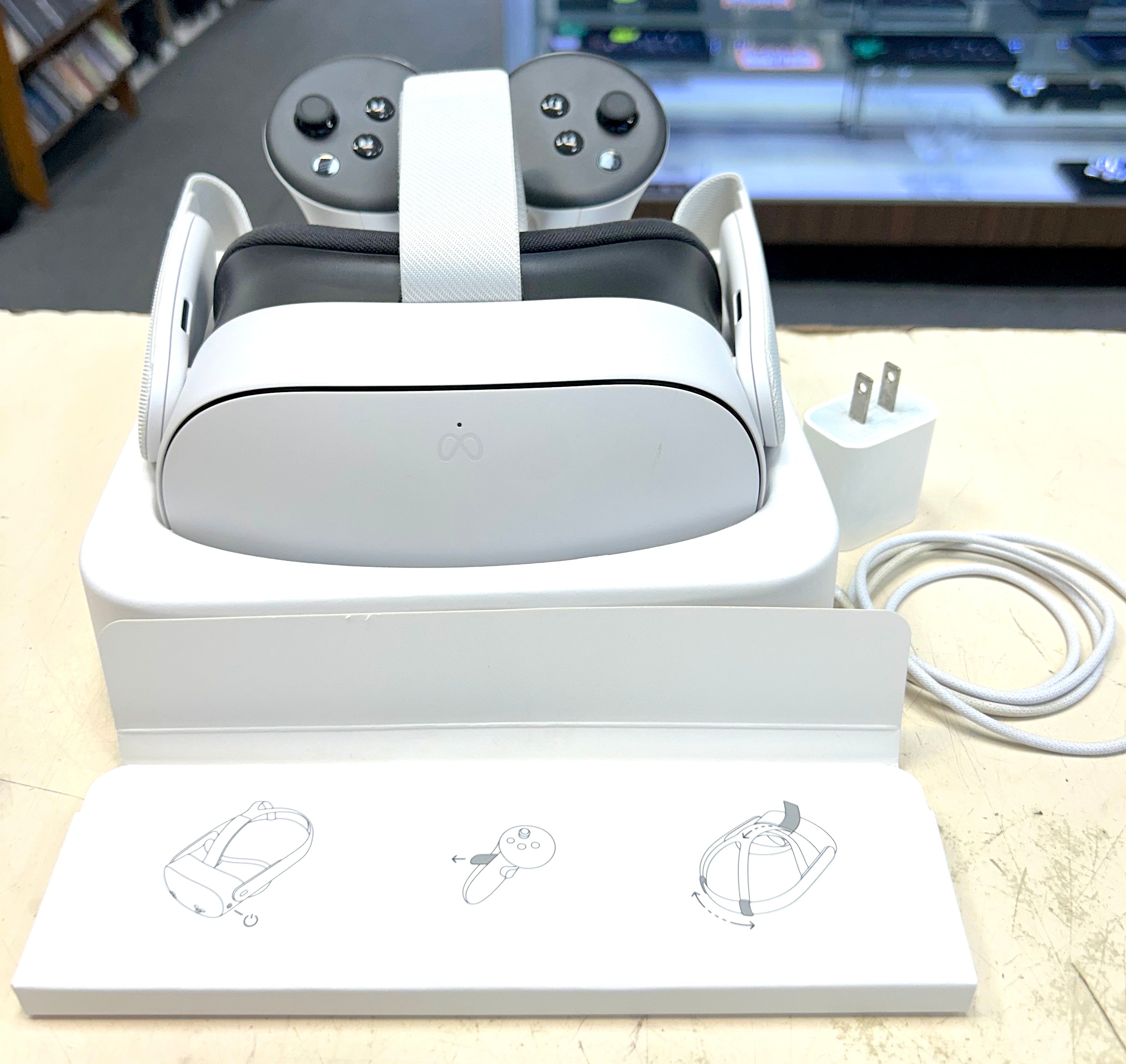 VR headset with controller and charging station on a table