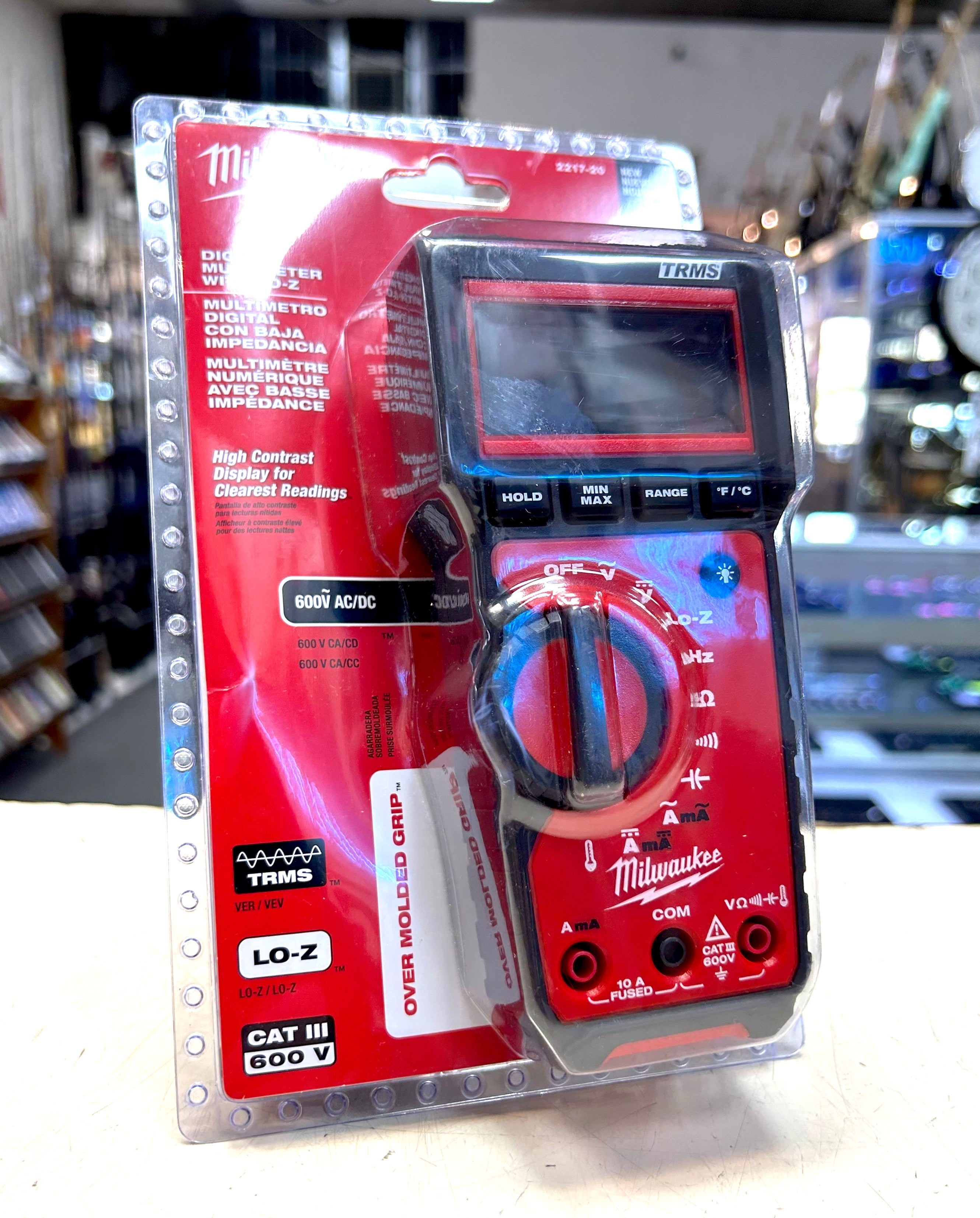 Milwaukee digital multimeter in packaging on a blurred background