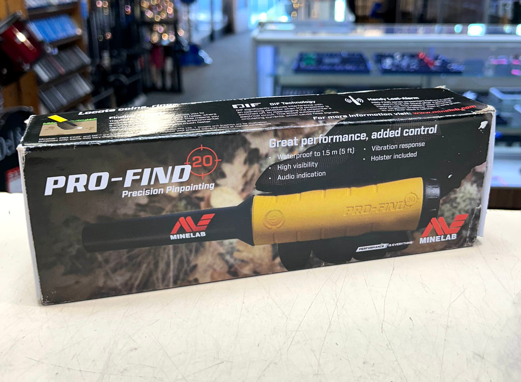Minelab Pro-Find 20 metal detector packaging on a counter with store shelves in the background