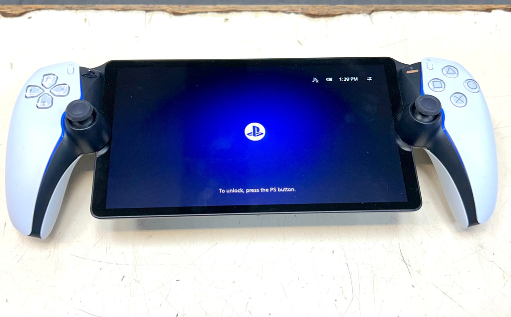 PlayStation controller with screen displaying login screen on a white surface