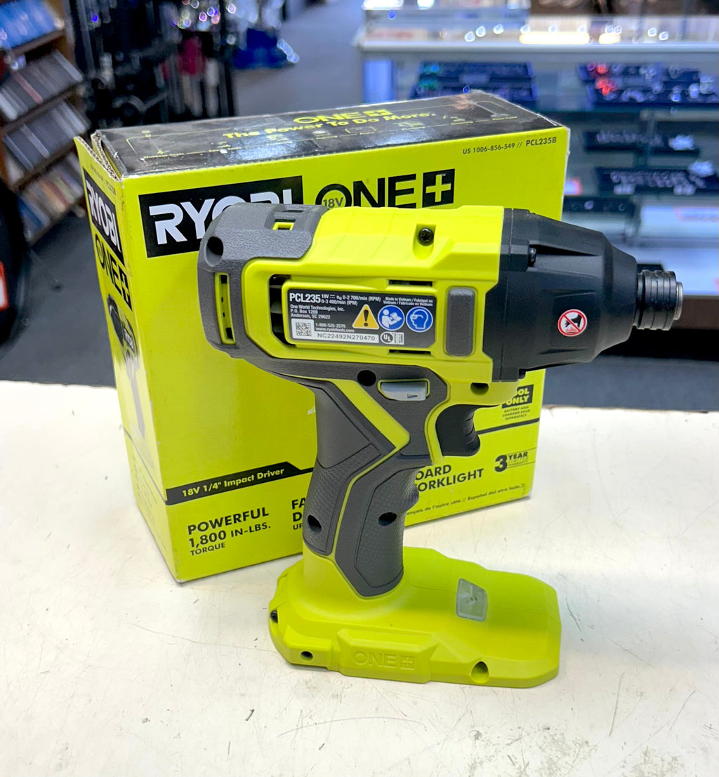 Yellow and black power drill with Ryobi branding on a white surface.