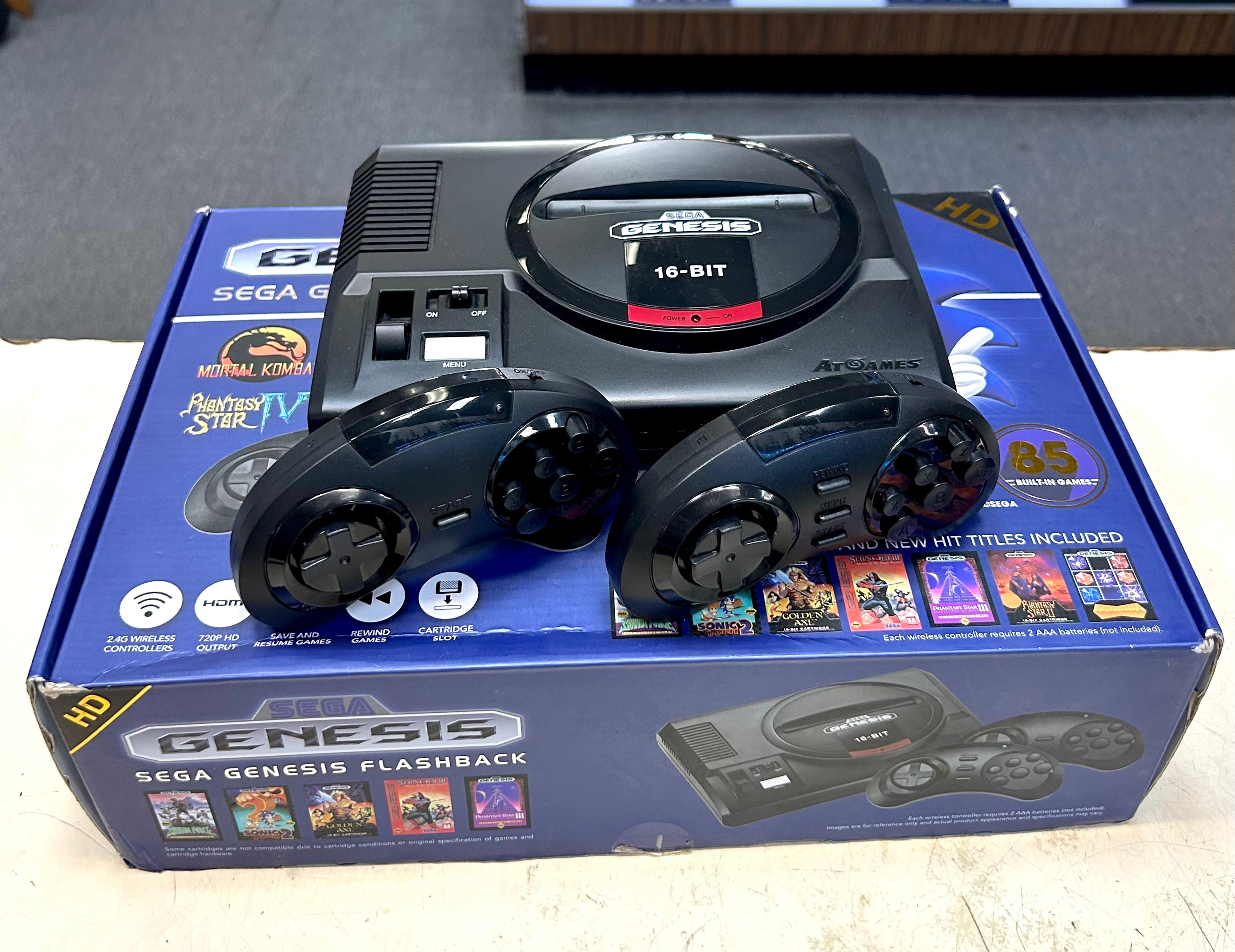 Sega Genesis Flashback console with controllers on its packaging