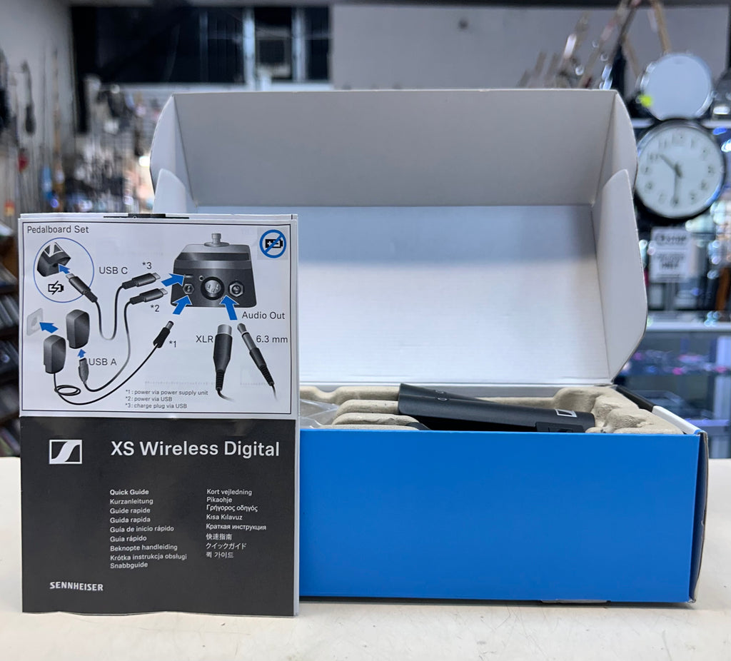 Sennheiser XS Wireless Digital microphone set packaging with accessories on a blurred background