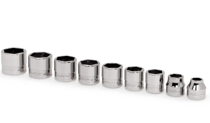 Set of metallic sockets on a white background