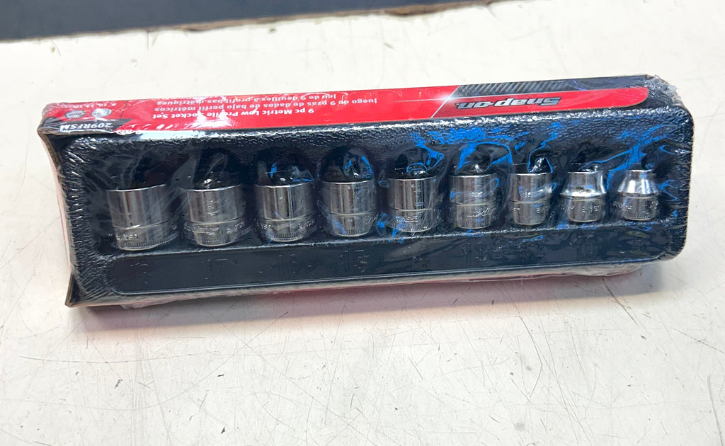 Set of socket wrenches in packaging on a white surface