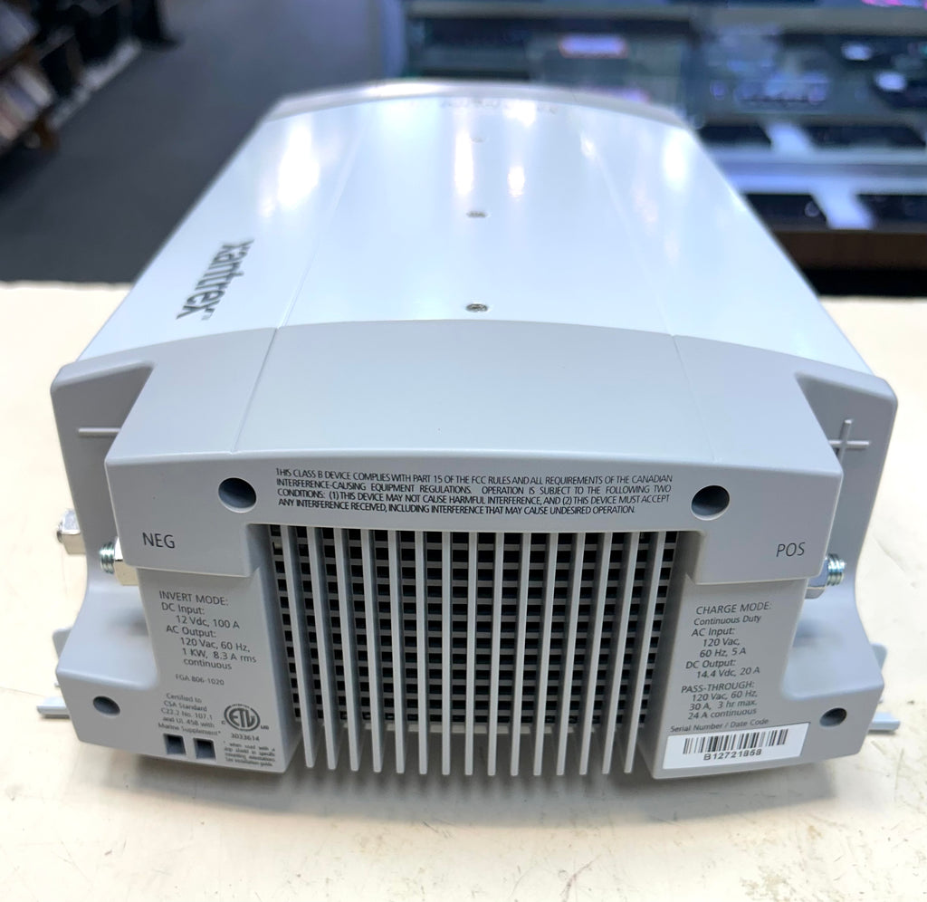 Back view of a power supply unit with branding on a blurred background